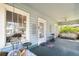 Inviting front porch with comfortable seating, creating a perfect outdoor living space with a view at 306 S Albany Ave, Tampa, FL 33606