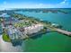 Beautiful aerial view of the condo building surrounded by ocean and city landscape at 500 Treasure Island Cswy # 308, Treasure Island, FL 33706