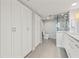 Tastefully renovated bathroom with tile flooring, modern vanity and glass-enclosed shower at 500 Treasure Island Cswy # 308, Treasure Island, FL 33706