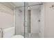 Bathroom features a glass shower door with a tiled shower and modern fixtures at 500 Treasure Island Cswy # 308, Treasure Island, FL 33706