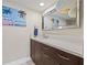 Stylish bathroom with beach themed decor and updated fixtures at 500 Treasure Island Cswy # 308, Treasure Island, FL 33706