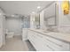Modern bathroom featuring dual sinks, sleek cabinetry and a glass-enclosed shower at 500 Treasure Island Cswy # 308, Treasure Island, FL 33706