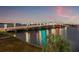 Scenic view of the bridge at sunset with illuminated lights reflecting on the calm water at 500 Treasure Island Cswy # 308, Treasure Island, FL 33706