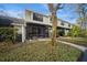 Serene backyard view with a screened patio and inviting landscaping, perfect for outdoor enjoyment at 5100 Burchette Rd # 306, Tampa, FL 33647
