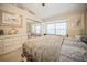 Bedroom featuring neutral walls, carpet floor, ceiling fan, and a large window seat at 5100 Burchette Rd # 306, Tampa, FL 33647