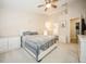 Bright bedroom featuring neutral walls, carpet floor, ceiling fan, and a private ensuite bathroom at 5100 Burchette Rd # 306, Tampa, FL 33647