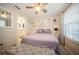 Bright bedroom featuring neutral walls, carpet floor, ceiling fan and a private ensuite bathroom at 5100 Burchette Rd # 306, Tampa, FL 33647