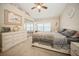 Bedroom featuring neutral walls, carpet floor, ceiling fan, and a large window seat at 5100 Burchette Rd # 306, Tampa, FL 33647