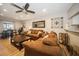 Spacious living room with hardwood floors, comfortable seating, and a ceiling fan at 5100 Burchette Rd # 306, Tampa, FL 33647