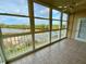 Enclosed balcony with water views and tile flooring, accessible from the main living area at 6315 Shoreline Dr # 3204, Seminole, FL 33708