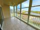 Enclosed balcony with large windows offering beautiful views of the surrounding waterway at 6315 Shoreline Dr # 3204, Seminole, FL 33708