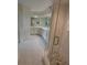 Bathroom featuring a glass shower, double sink vanity, and marble floors at 6315 Shoreline Dr # 3204, Seminole, FL 33708