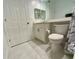 Clean bathroom with white marble-look tile, a modern vanity, and a toilet at 6315 Shoreline Dr # 3204, Seminole, FL 33708