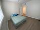 Cozy bedroom with wood-look floors, closet, and a ceiling fan at 6315 Shoreline Dr # 3204, Seminole, FL 33708