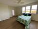 Bedroom featuring natural light, a ceiling fan, and beautiful water views at 6315 Shoreline Dr # 3204, Seminole, FL 33708