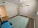 Well-lit bedroom features wood-look floors and a spacious closet at 6315 Shoreline Dr # 3204, Seminole, FL 33708