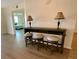 Hallway featuring a console table with three bar stools and lamps at 6315 Shoreline Dr # 3204, Seminole, FL 33708