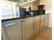 A kitchen with stainless steel appliances, wood cabinets, and dark countertop at 6315 Shoreline Dr # 3204, Seminole, FL 33708