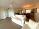 Bright living room with wood floors, neutral paint, and open layout to the kitchen and dining room at 6315 Shoreline Dr # 3204, Seminole, FL 33708