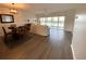 Open floor plan showing a kitchen with dining area and bright living room with balcony access at 6315 Shoreline Dr # 3204, Seminole, FL 33708