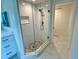 Walk in shower with tile floor and marble wall at 6315 Shoreline Dr # 3204, Seminole, FL 33708