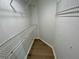 Organized walk-in closet with wire shelving and wood-look flooring, maximizing storage at 6315 Shoreline Dr # 3204, Seminole, FL 33708