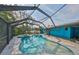 Screened pool with attached spa, set against a bright blue home exterior at 6560 5Th S Ave, St Petersburg, FL 33707