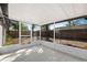 Light and airy screened porch with views of the backyard at 10108 Hunters Point Ct, Tampa, FL 33615