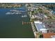 This aerial view showcases a marina with many boats, waterfront buildings, and ample parking, all in a coastal community at 1028 Apollo Beach Blvd # 13, Apollo Beach, FL 33572