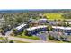 Aerial view of the townhome featuring mature landscaping and ample parking near local recreational park at 1370 70Th N St # 2-1382, St Petersburg, FL 33710