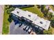 Bird's-eye view of the condo featuring mature landscaping, assigned parking, and AC units at 1370 70Th N St # 2-1382, St Petersburg, FL 33710