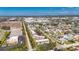 Aerial view of a multi-unit apartment complex in a residential neighborhood with street access and nearby building at 1370 70Th N St # 2-1382, St Petersburg, FL 33710