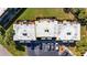 Aerial view of condo featuring well-maintained roof, parking and exterior AC units at 1370 70Th N St # 2-1382, St Petersburg, FL 33710