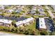 Aerial view of the property with lush landscaping and ample parking at 1370 70Th N St # 2-1382, St Petersburg, FL 33710
