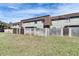 Exterior shot of the backyard featuring a grassy area and privacy fence at 1370 70Th N St # 2-1382, St Petersburg, FL 33710