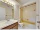 Well-lit bathroom featuring vanity, mirror, toilet and tub at 1370 70Th N St # 2-1382, St Petersburg, FL 33710