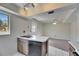 Open kitchen area with stainless steel appliances, white tile flooring, and eat in dining at 1370 70Th N St # 2-1382, St Petersburg, FL 33710