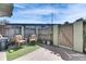 Cozy fenced patio area featuring outdoor seating and a charming gate at 1370 70Th N St # 2-1382, St Petersburg, FL 33710