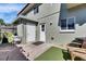 Outdoor patio area with a small table, chairs, and greenery, perfect for relaxation at 1370 70Th N St # 2-1382, St Petersburg, FL 33710