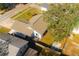 Aerial view of house showing big tree in back yard, partial fence and patio set at 16109 Northglenn Dr, Tampa, FL 33618