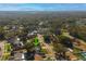 This aerial shows the home's location within its neighborhood and proximity to nearby wooded areas at 16109 Northglenn Dr, Tampa, FL 33618