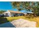 Large backyard with grass and a patio area at 16109 Northglenn Dr, Tampa, FL 33618