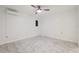 This bedroom features modern marble floors, a ceiling fan, and split unit air conditioning at 16109 Northglenn Dr, Tampa, FL 33618
