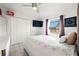 Cozy bedroom featuring a comfortable queen-sized bed, closet, and a view of the outside at 16109 Northglenn Dr, Tampa, FL 33618
