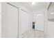 Bright entryway featuring marble floors, multiple closets, and a front door with decorative glass inserts at 16109 Northglenn Dr, Tampa, FL 33618