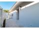 Exterior view of the side yard, showing a white fence and gate that provides outdoor access at 16109 Northglenn Dr, Tampa, FL 33618