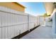 Side yard with white wood fence providing privacy and security to the property at 16109 Northglenn Dr, Tampa, FL 33618