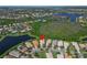 Home with beautiful lake views and landscaping in a serene neighborhood at 16135 Cape Coral Dr, Wimauma, FL 33598