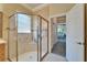 Bathroom features shower and view of primary bedroom at 16135 Cape Coral Dr, Wimauma, FL 33598