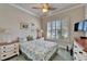 Comfortable bedroom with shuttered window, neutral colored walls and carpet at 16135 Cape Coral Dr, Wimauma, FL 33598